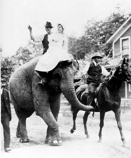 Joe and Myra Keaton, parents of movie comedian Buster Keaton, ride on an elephant.